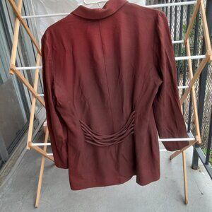 Woman Brown suit. Jacket top size 10, Trouser size 12.